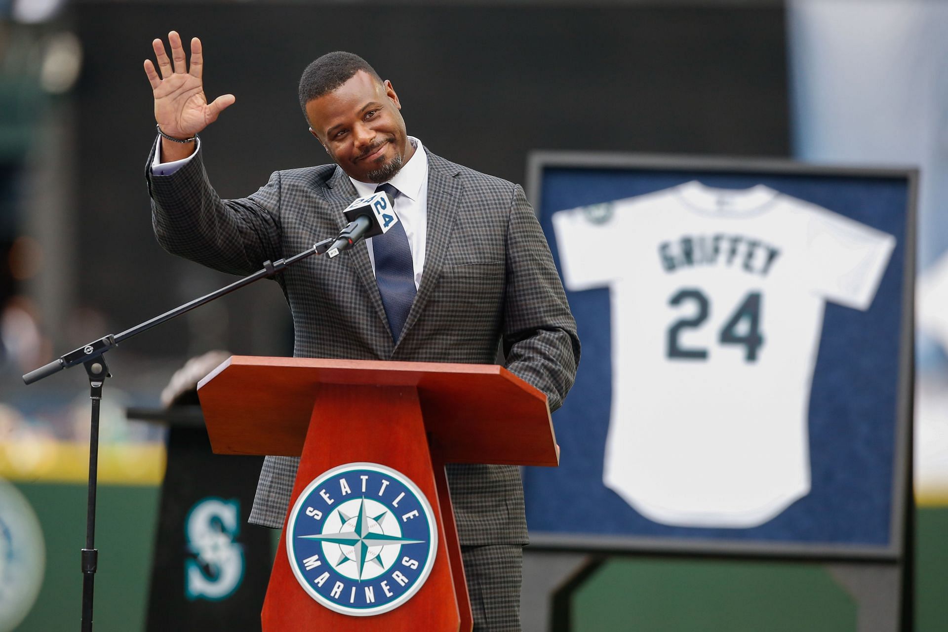 Former Mariner Ken Griffey Jr. waves to the crowd during a jersey retirement ceremony.