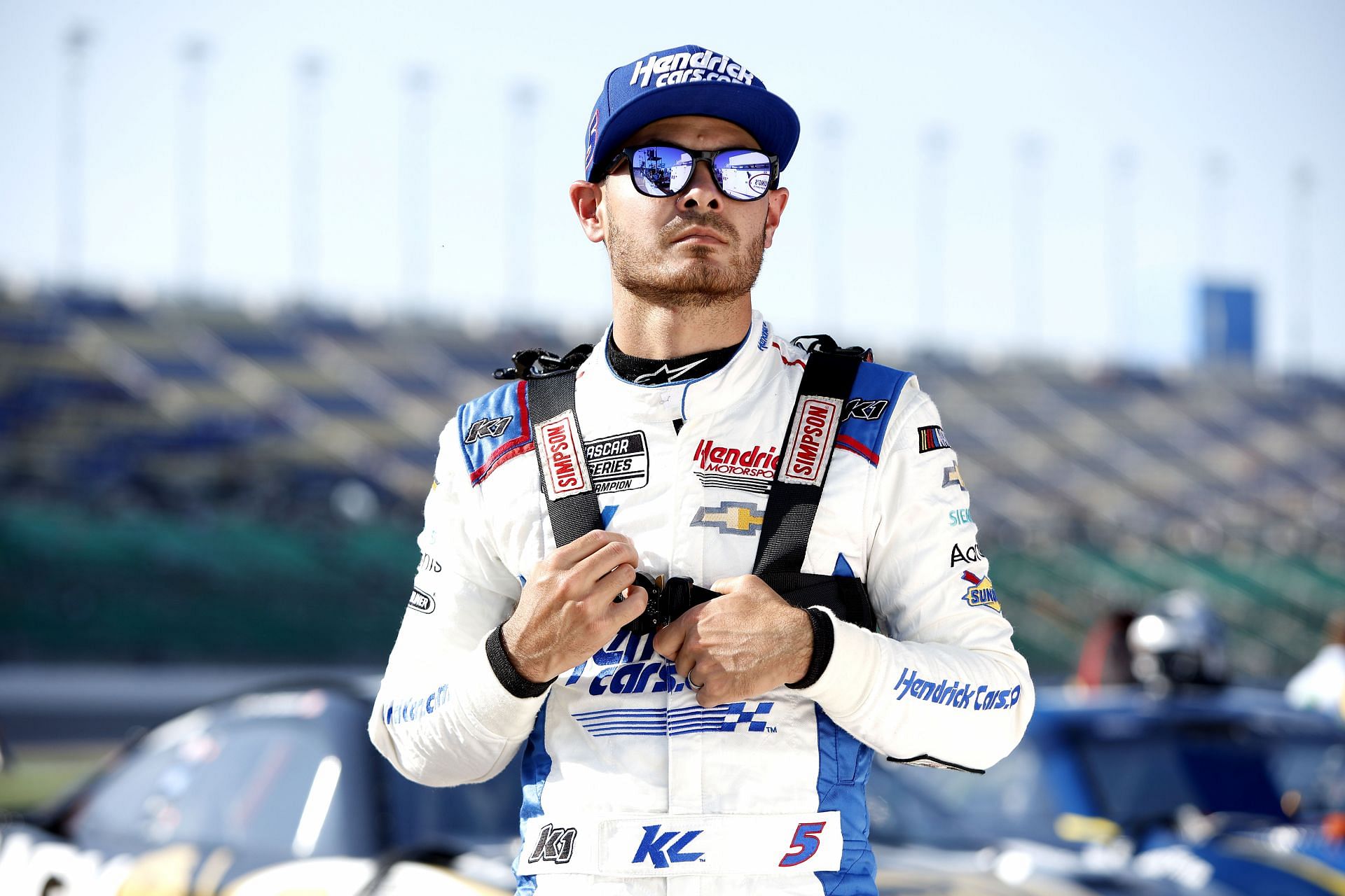 Kyle Larson looks on during qualifying for the NASCAR Cup Series AdventHealth 400 at Kansas Speedway.