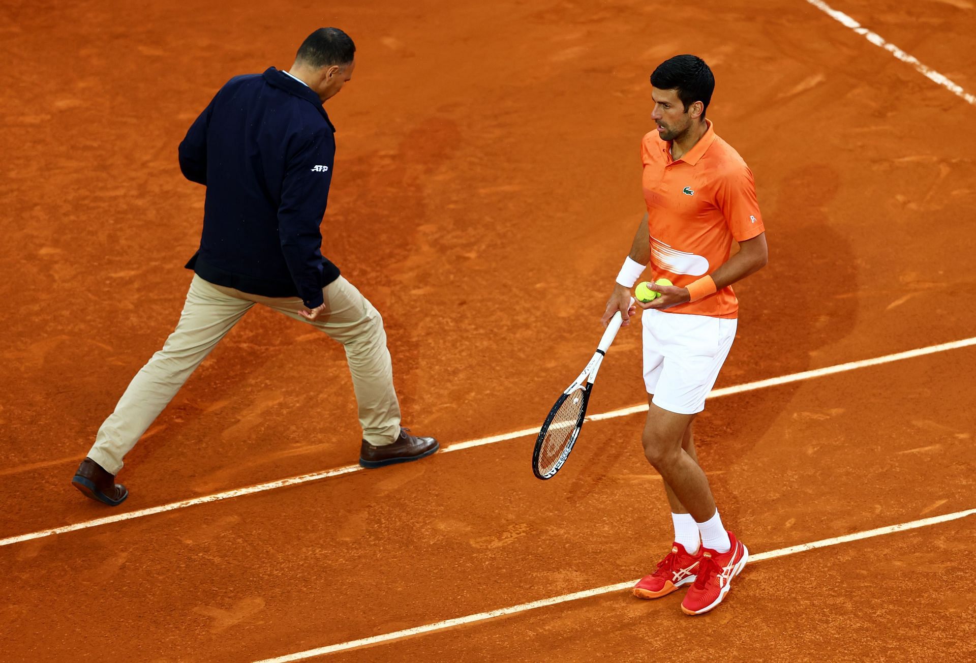 Novak Djokovic (right) beat Gael Monfils in his Madrid Masters opener.