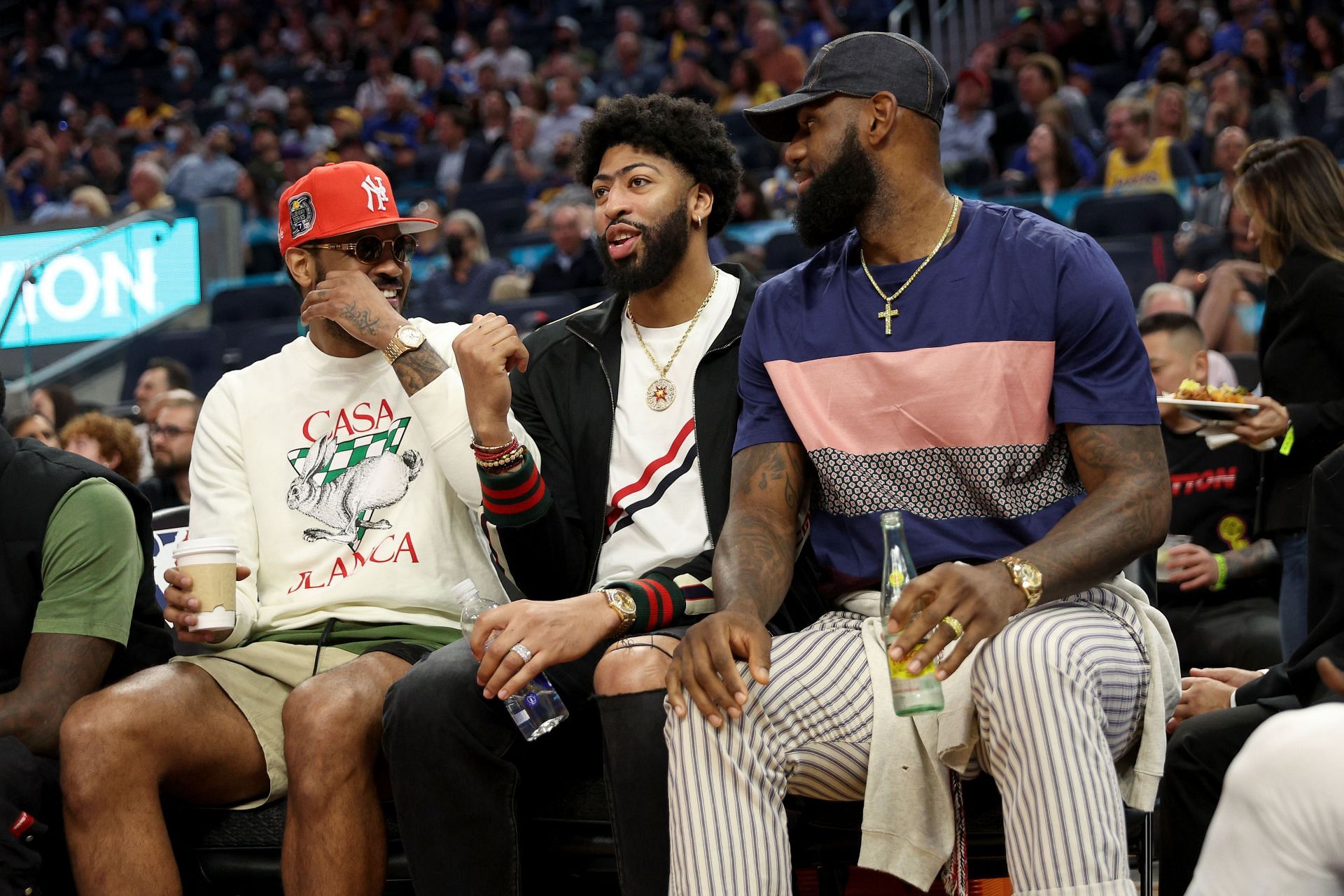 (L-R) Carmelo Anthony, Anthony Davis, and LeBron James of the LA Lakers on the bench.
