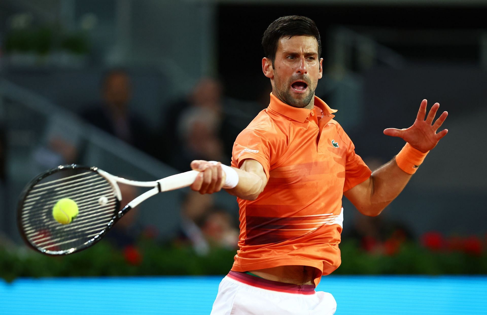 Novak Djokovic plays a forehand in his second round match against Gael Monfils