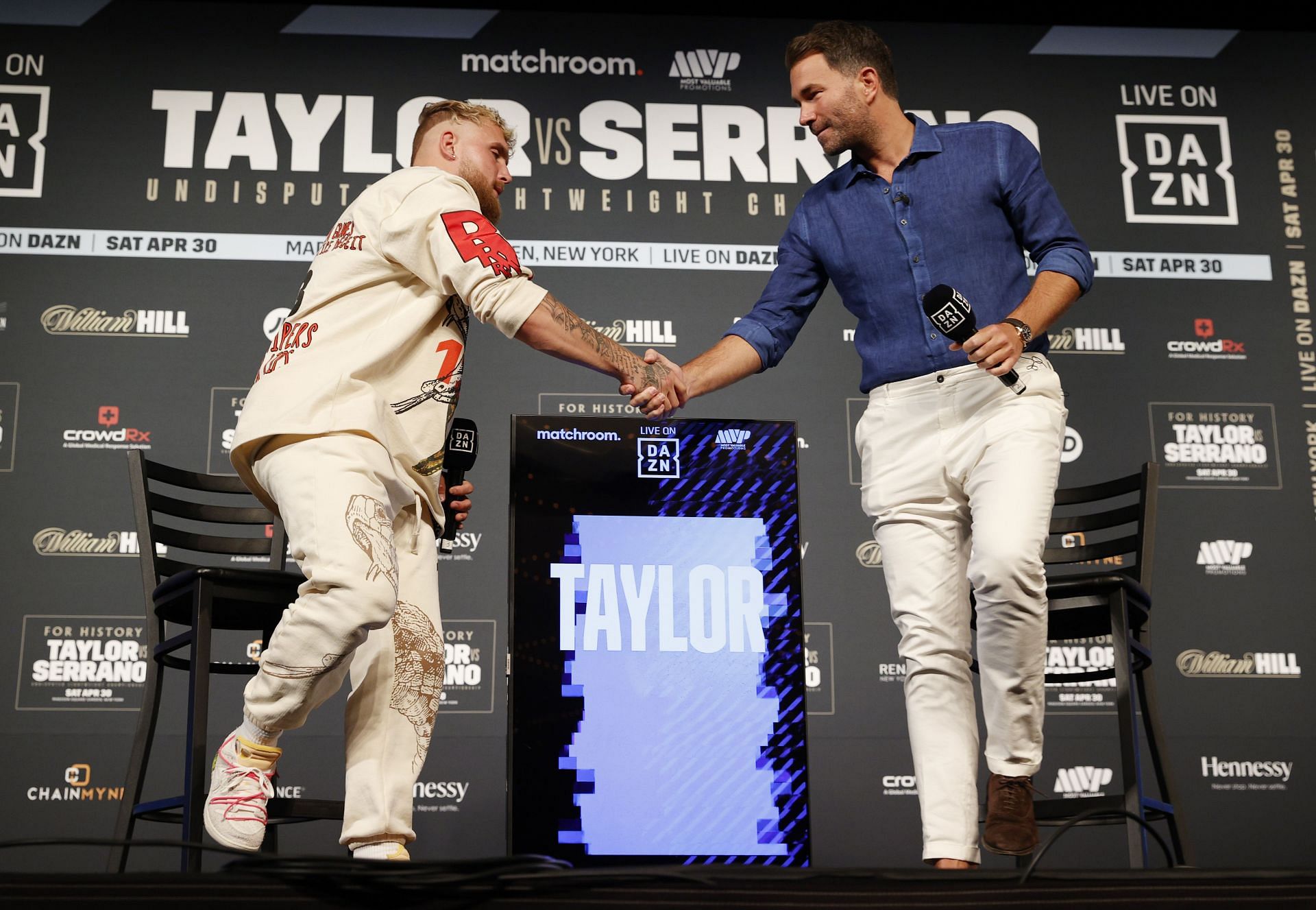 Jake Paul (left) and Eddie Hearn (right) shake hands at the Katie Taylor vs Amanda Serrano weigh-in.