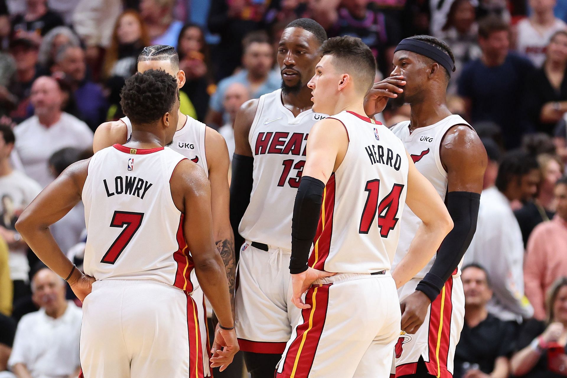 Miami Heat players huddle up during an NBA game.