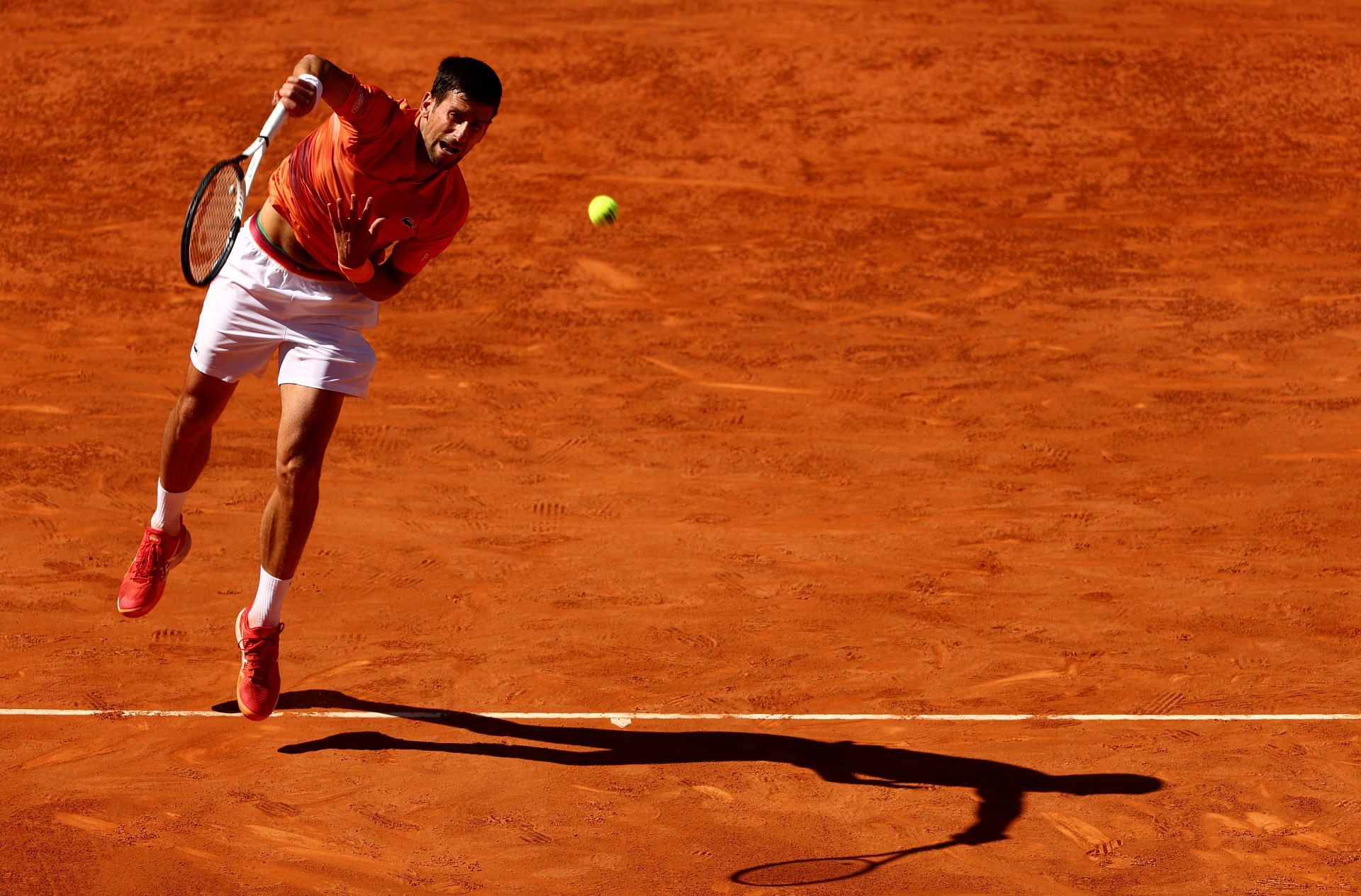 Novak Djokovic in action against Carlos Alcaraz in Madrid