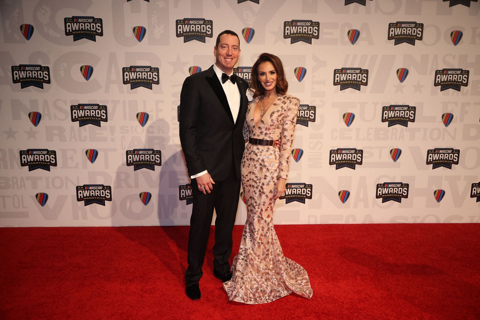 Kyle Busch and wife Samantha Busch pose on the red carpet prior to the NASCAR Champion&#039;s Banquet at the Music City Center (Photo by Chris Graythen/Getty Images)