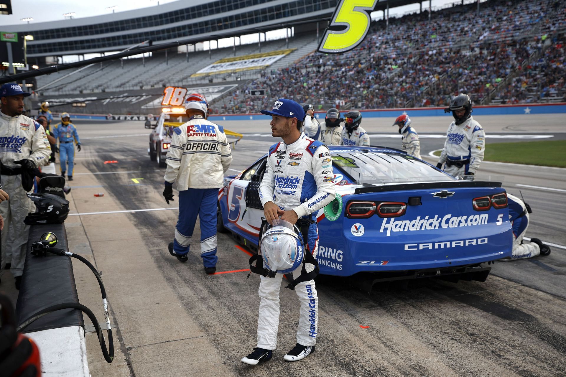 Kyle Larson exits his car after an on-track incident during the NASCAR Cup Series All-Star Race at Texas Motor Speedway