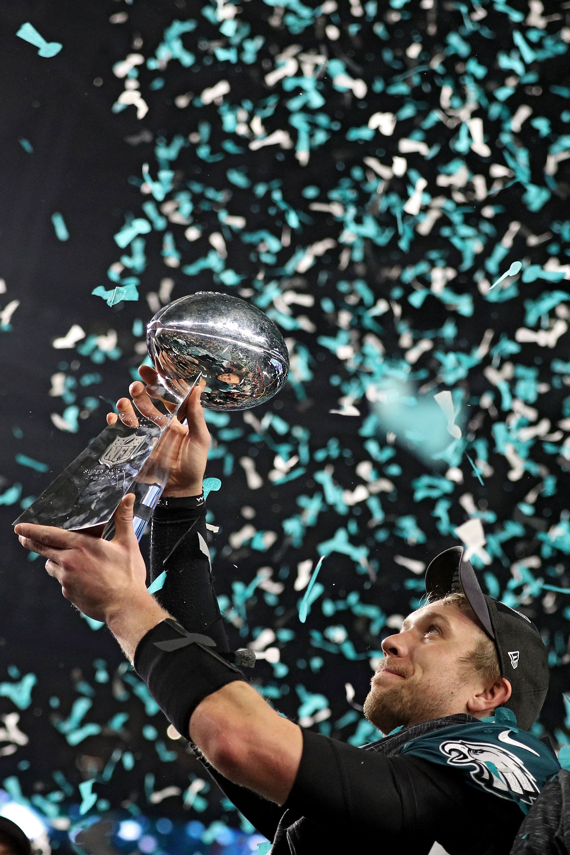 The QB with the Eagles hoisting the Lombardi Trophy after winning Super Bowl LII over the Patriots