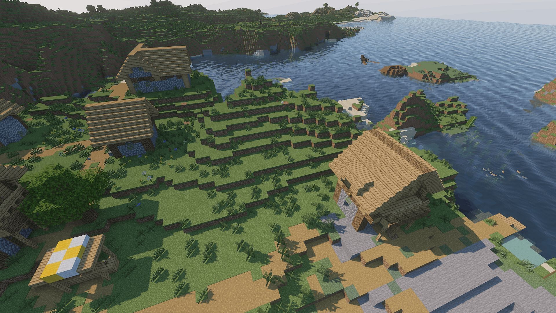 A coastal village with the Continuum shader (Image via Minecraft)