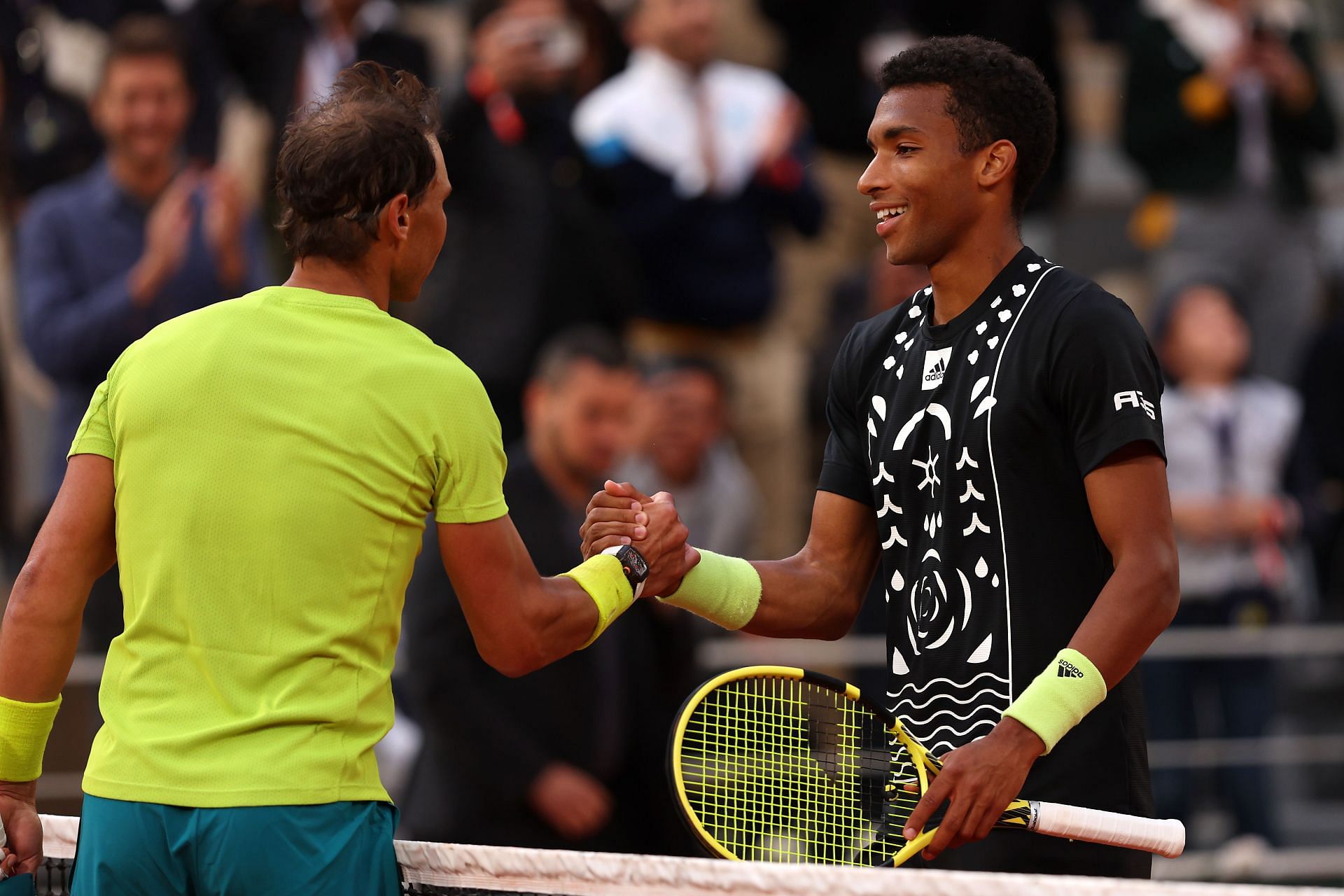 Rafael Nadal shakes hands with Felix Auger-Aliassime at the 2022 French Open