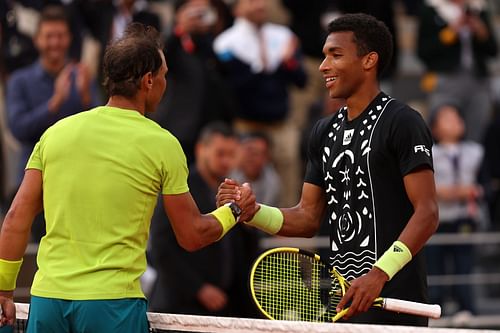 Rafael Nadal shakes hands with Felix Auger-Aliassime at the 2022 French Open