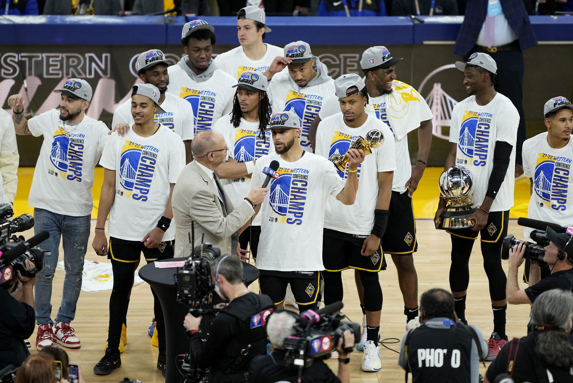 Steph Curry and the Golden State Warriors celebrate the Western Conference championship.