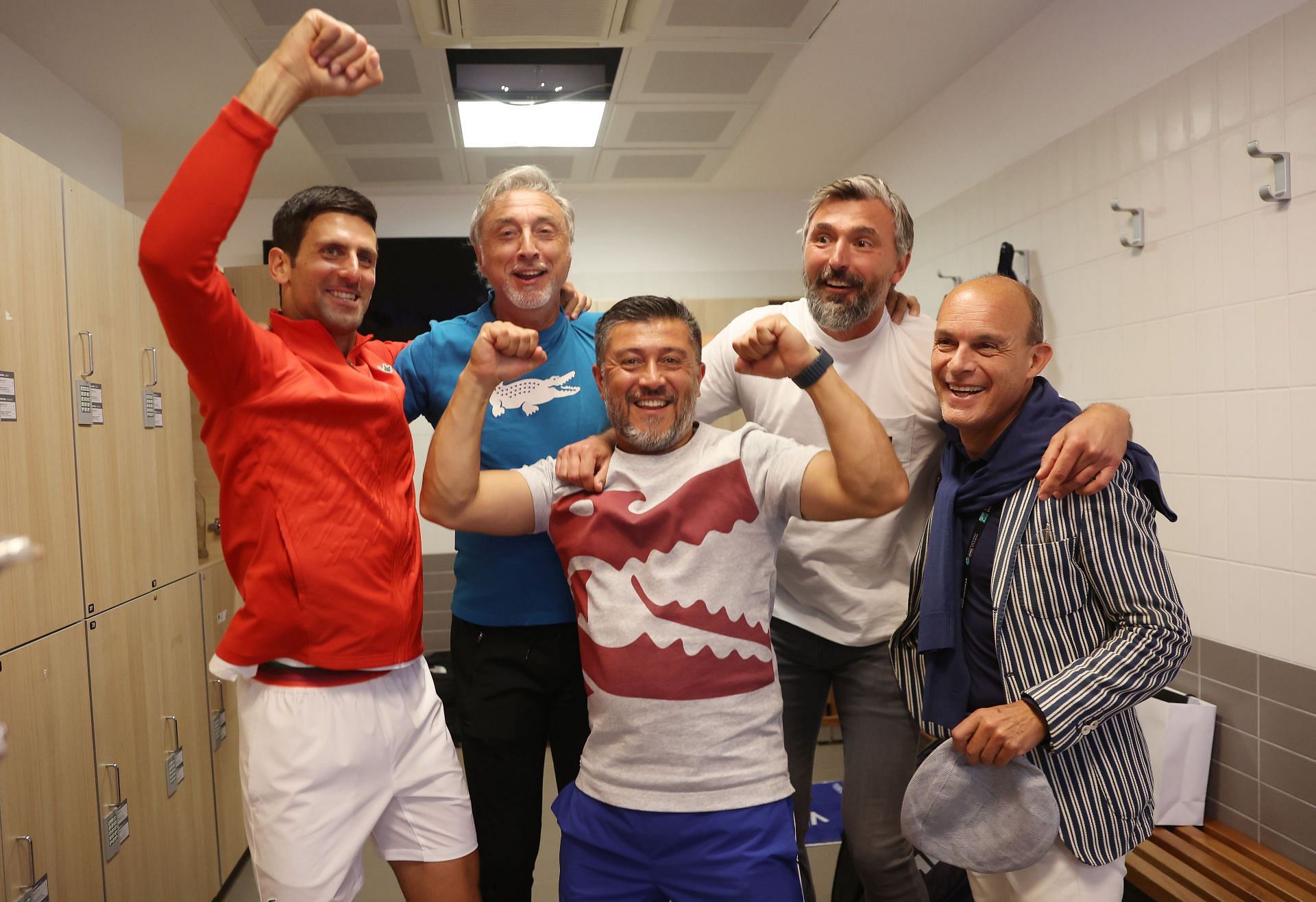Novak Djokovic celebrates with his team after winning the Italian Open a sixth time.