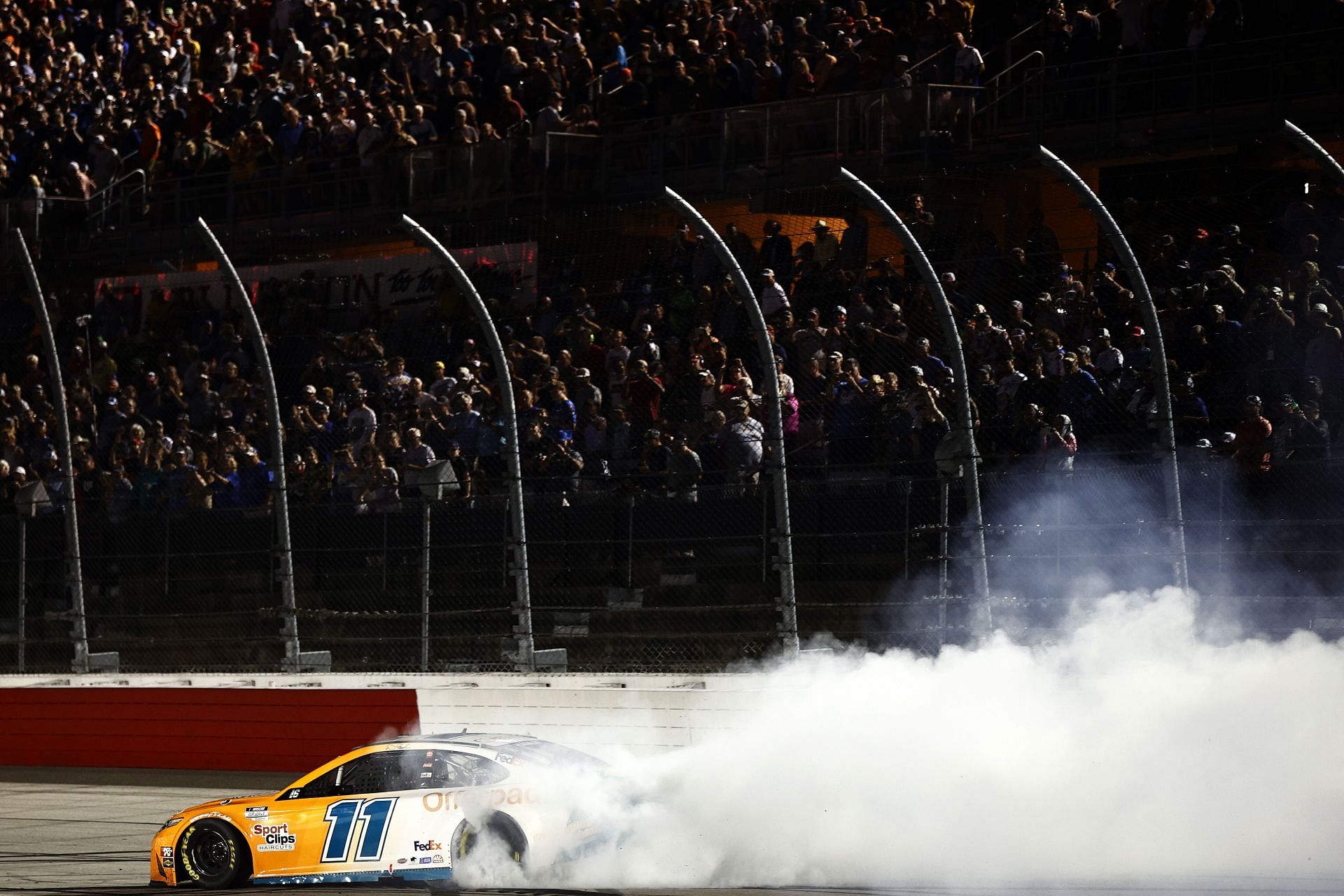 Denny Hamlin celebrates with a burnout after winning the 2021 NASCAR Cup Series Cook Out Southern 500 at Darlington Raceway in Darlington, South Carolina. (Photo by Jared C. Tilton/Getty Images)