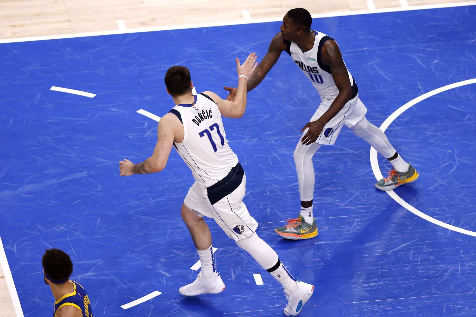 Luka Doncic and Dorian Finney-Smith celebrate a play