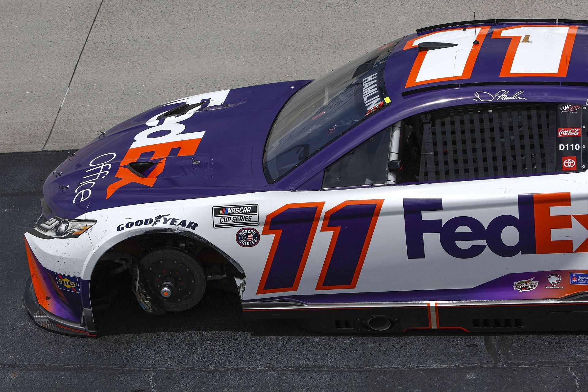 Denny Hamlin drives without the left front tire after a pit stop during the 2022 NASCAR Cup Series DuraMAX Drydene 400 presented by RelaDyne at Dover Motor Speedway in Dover, Delaware. (Photo by Sean Gardner/Getty Images)