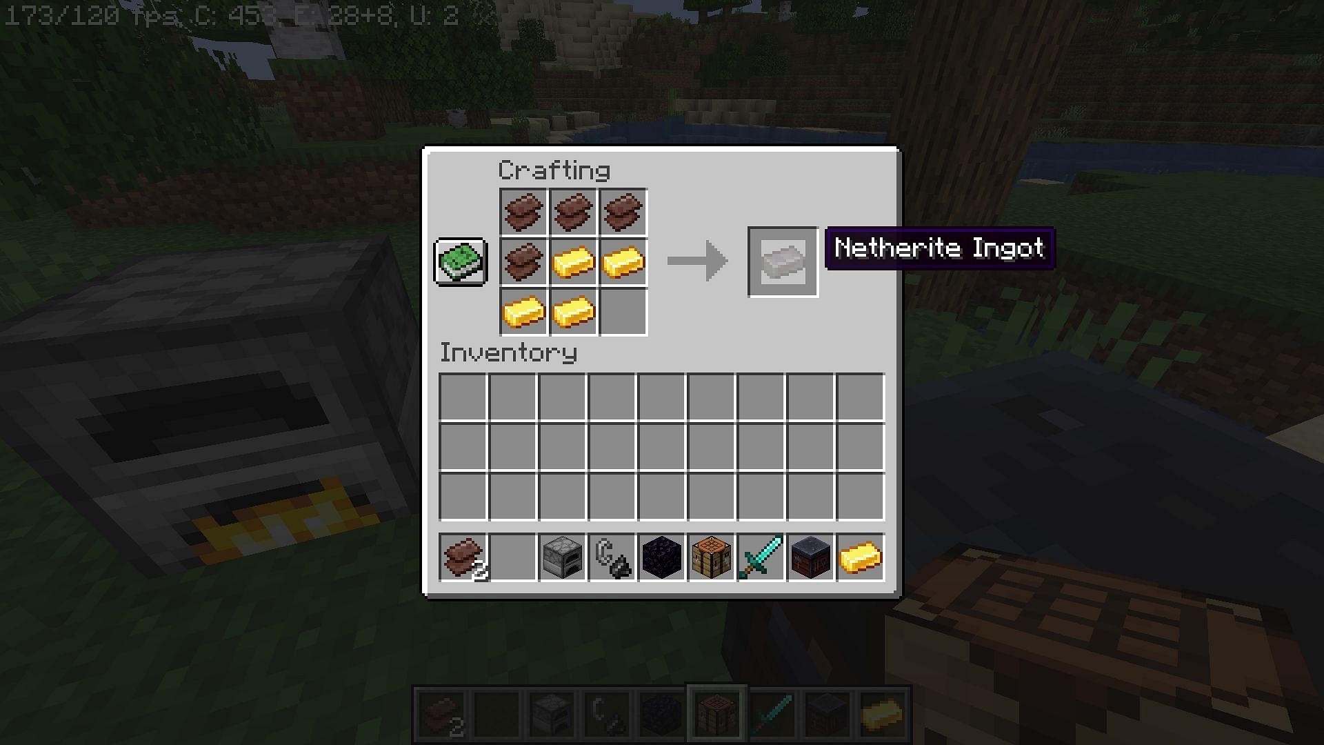 Crafting the ingot with scraps and gold ingots (Image via Minecraft)