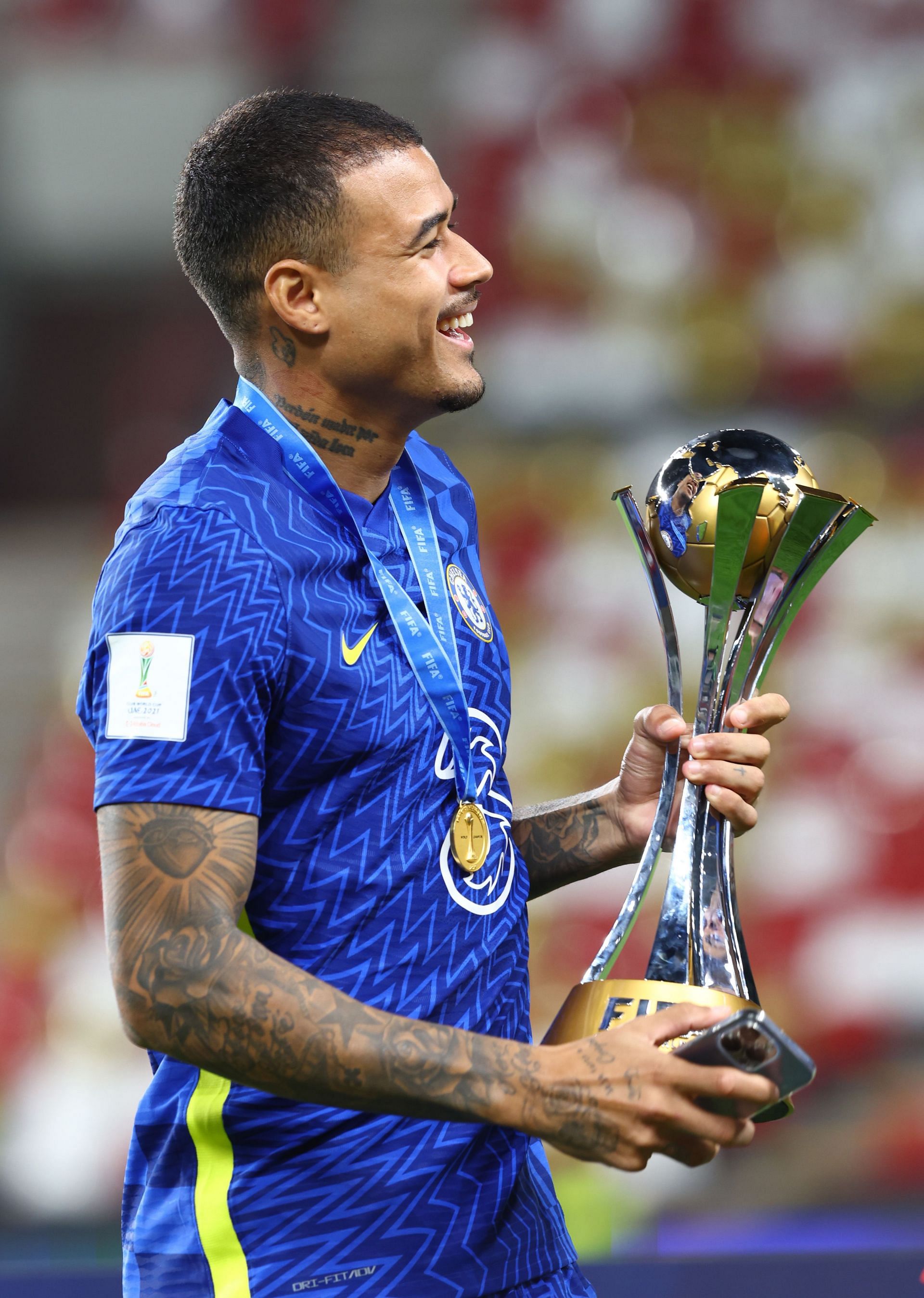 Kenedy holding the FIFA Clun World Cup trophy