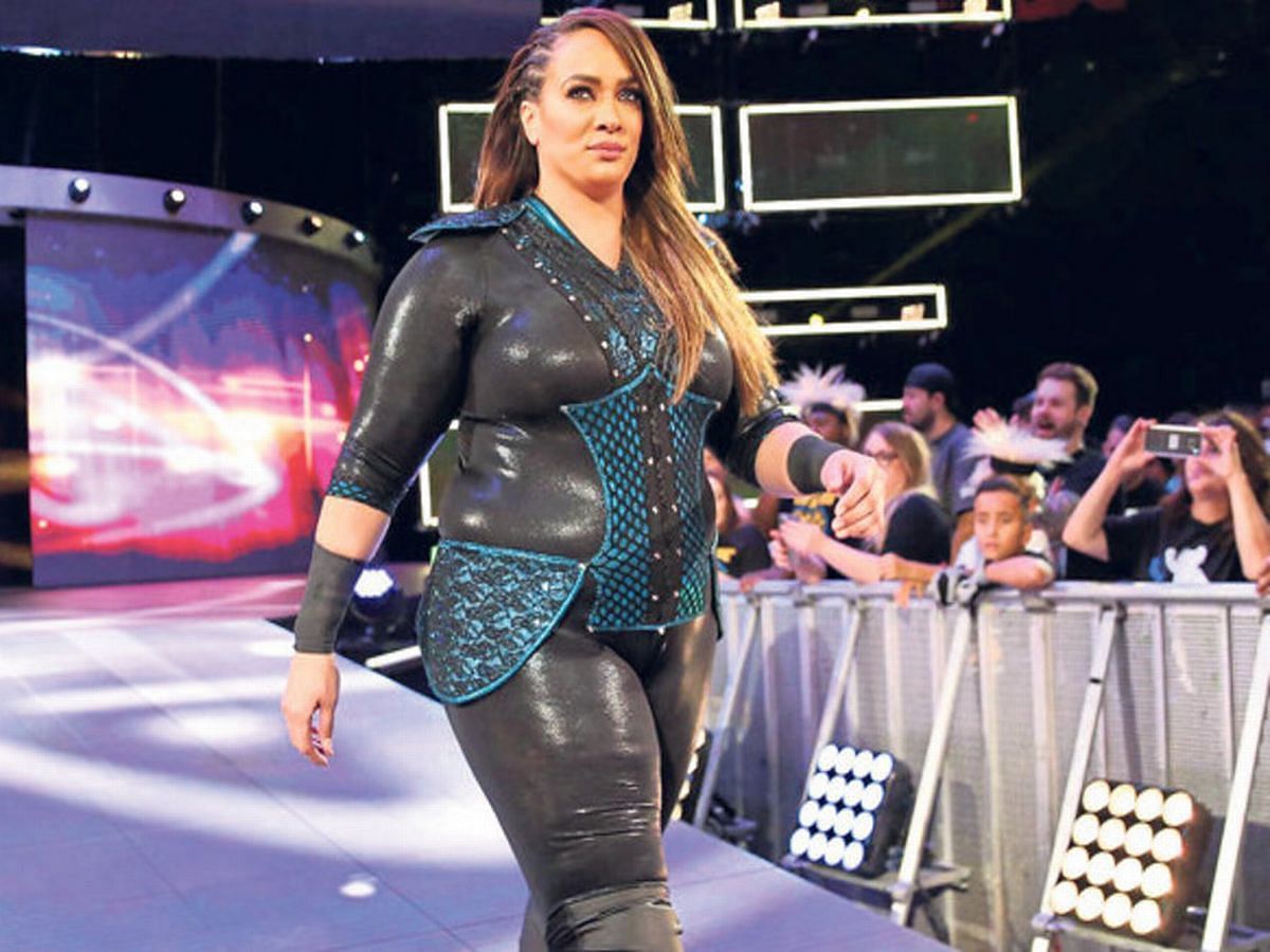 Jax making her way to the ring during a WWE match.