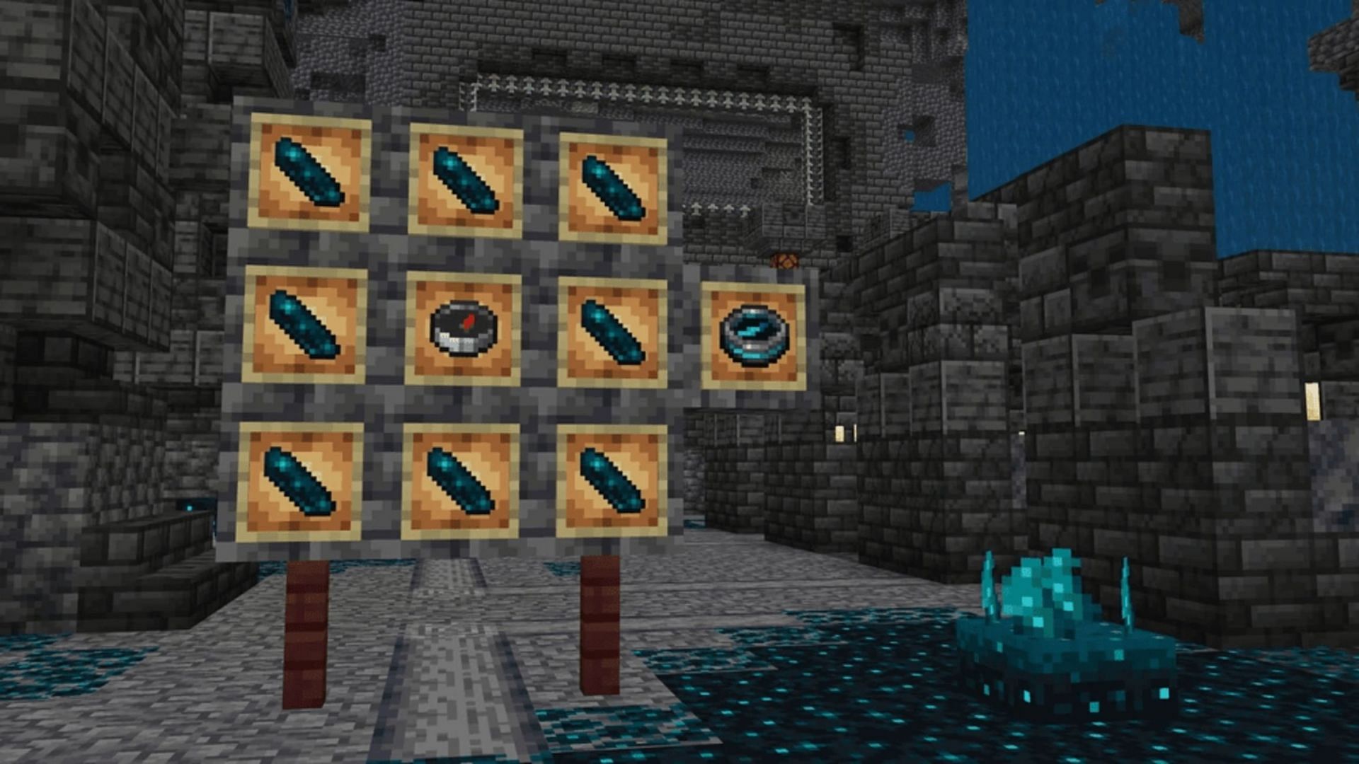 The crafting recipe for the recovery compass illustrated in item frames (Image via Mojang)