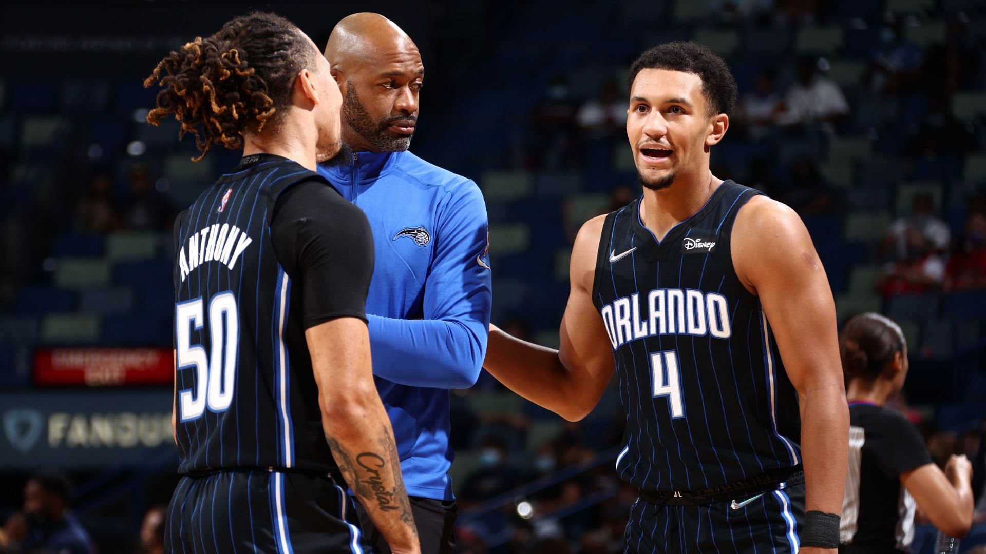 Cole Anthony and Jalen Suggs with Orlando Magic coach Jamahl Mosley.