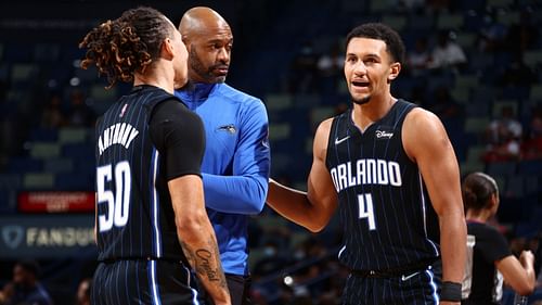 Cole Anthony and Jalen Suggs with Orlando Magic coach Jamahl Mosley.