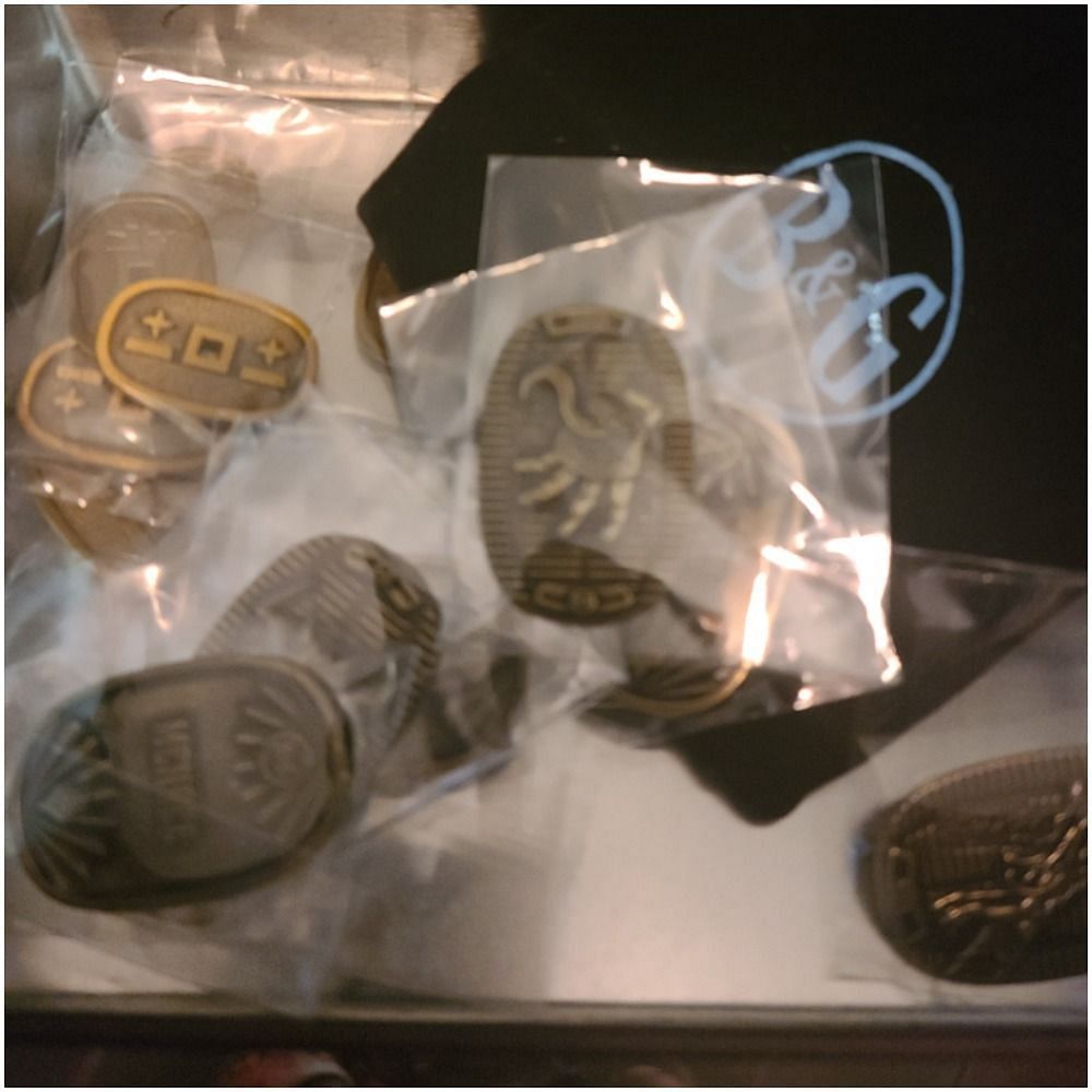 These coins and charms to use as counters for abilities, buffs and debuffs are gorgeous and visually striking (Image via Beadle &amp; Grimm)