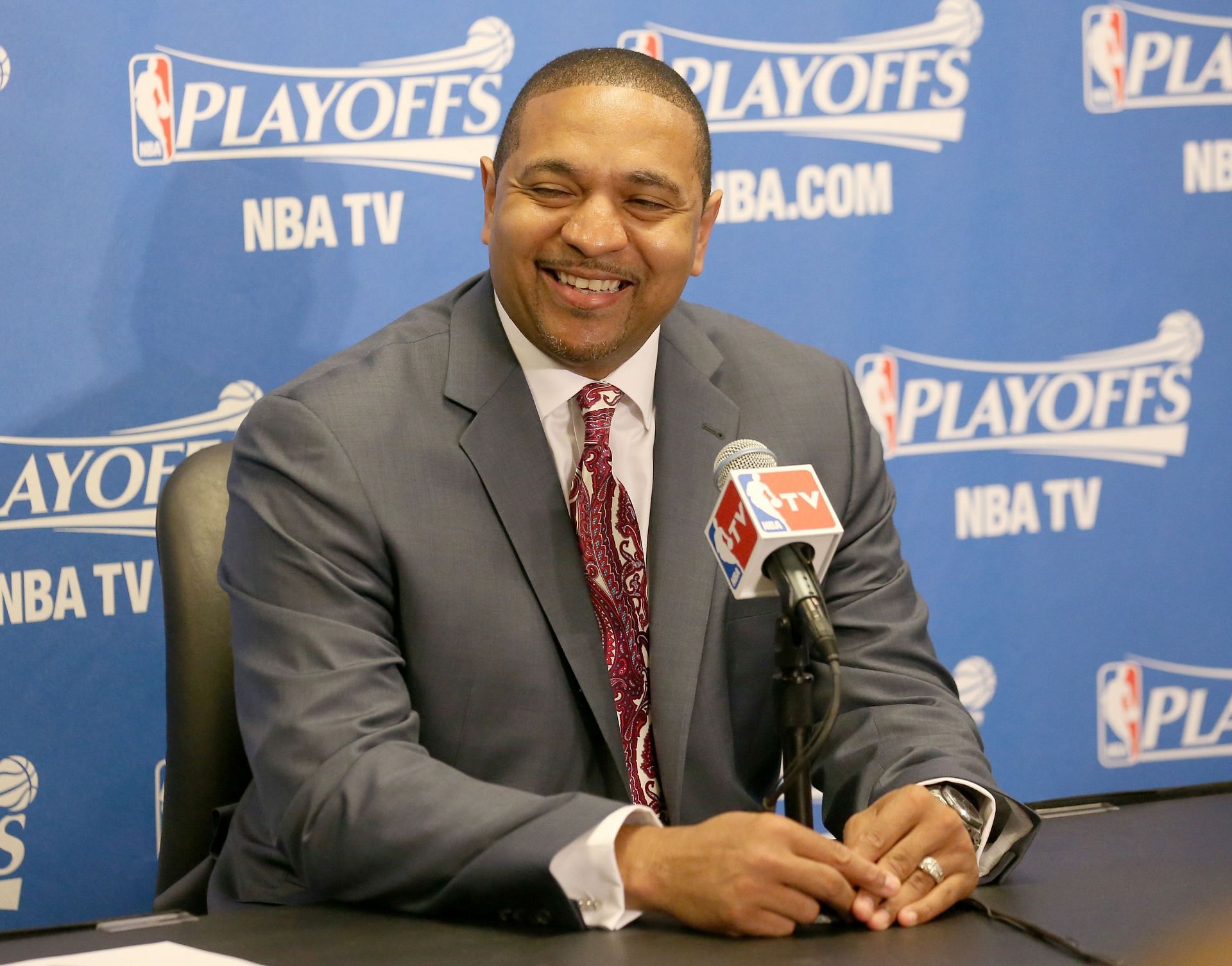 Head coach Mark Jackson of the Golden State Warriors laughs after being asked a question at a press conference.