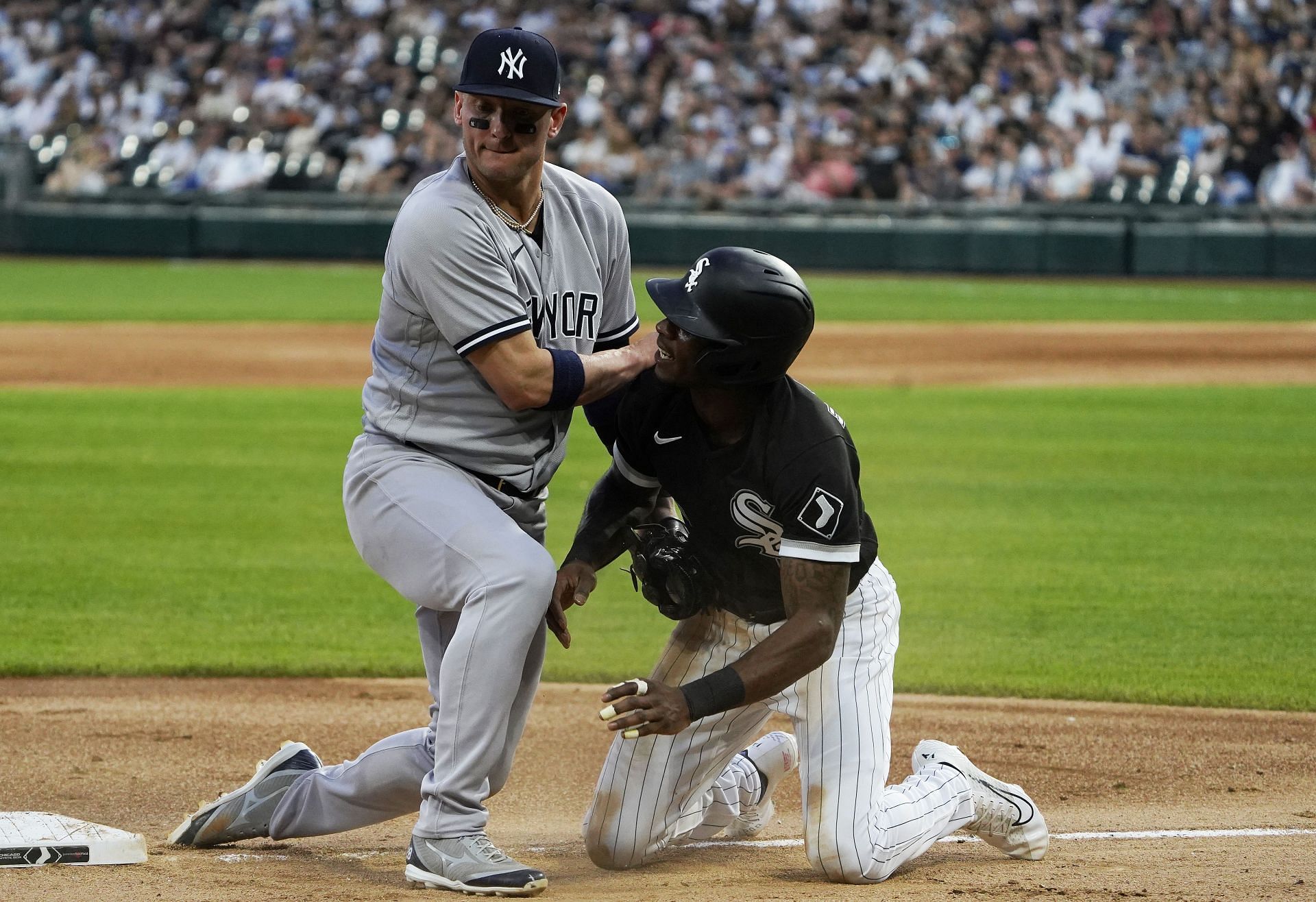Josh Donaldson of the New York Yankees blocks third base as Tim Anderson of the Chicago White Sox slides in during Saturday&#039;s game