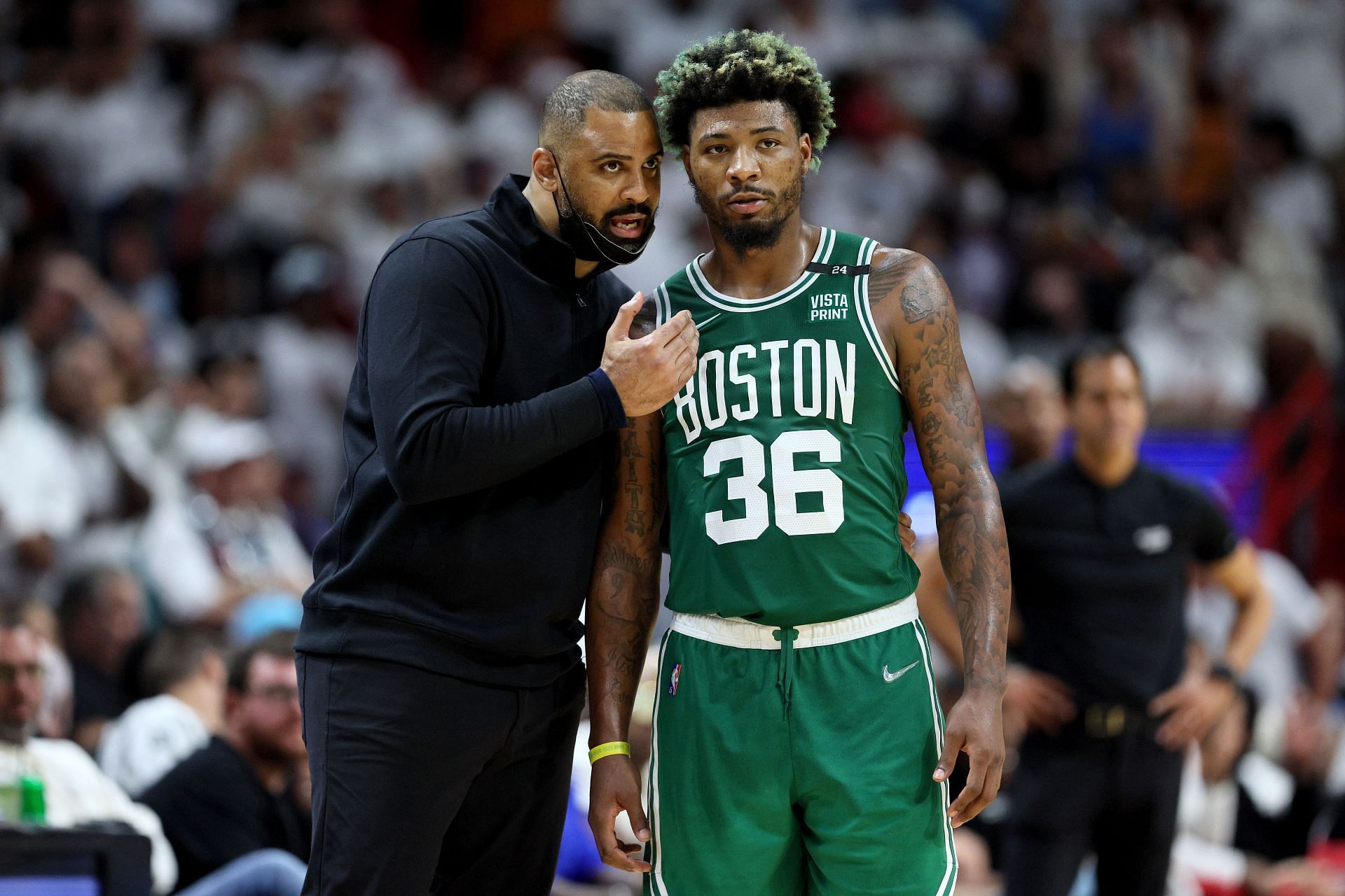 Ime Udoka in discussion with Marcus Smart.
