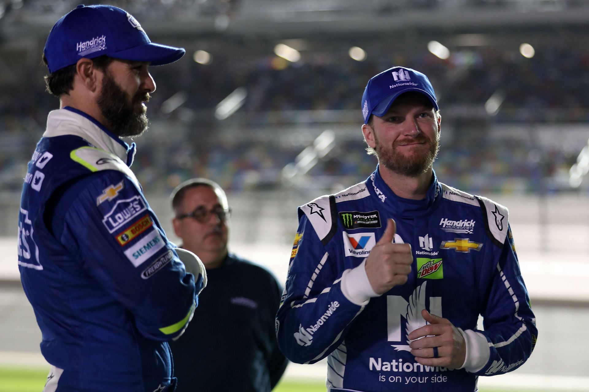 Jimmie Johnson (L) and Dale Earnhardt Jr (R) talk prior to the Monster Energy NASCAR Cup Series Can-Am Duel 2 at Daytona International Speedway