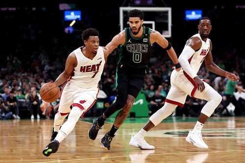 Kyle Lowry  of the Miami Heat dribbles past Jayson Tatum of the Boston Celtics.