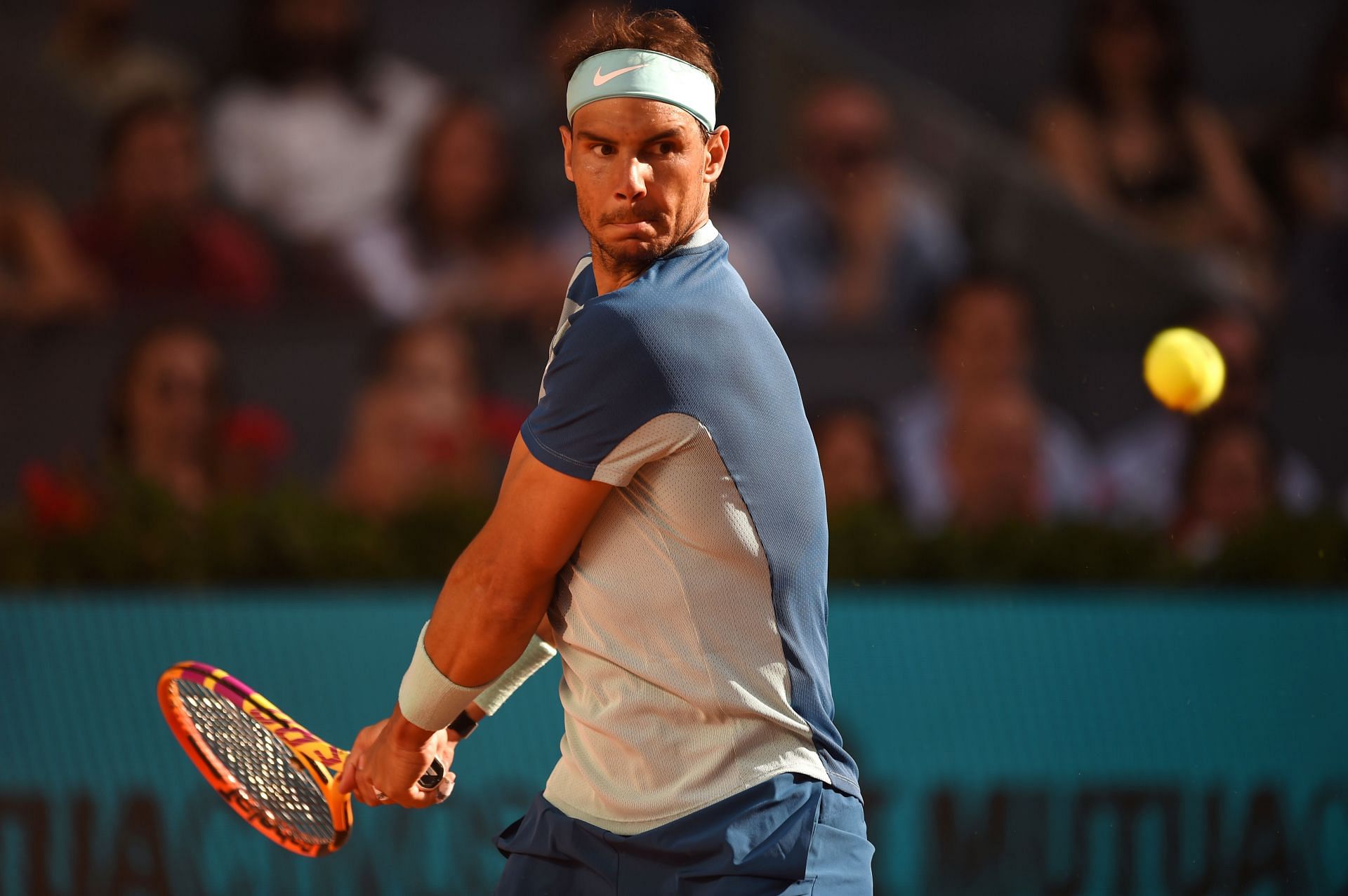 Rafael Nadal plays a backhand during the 2022 Mutua Madrid Open