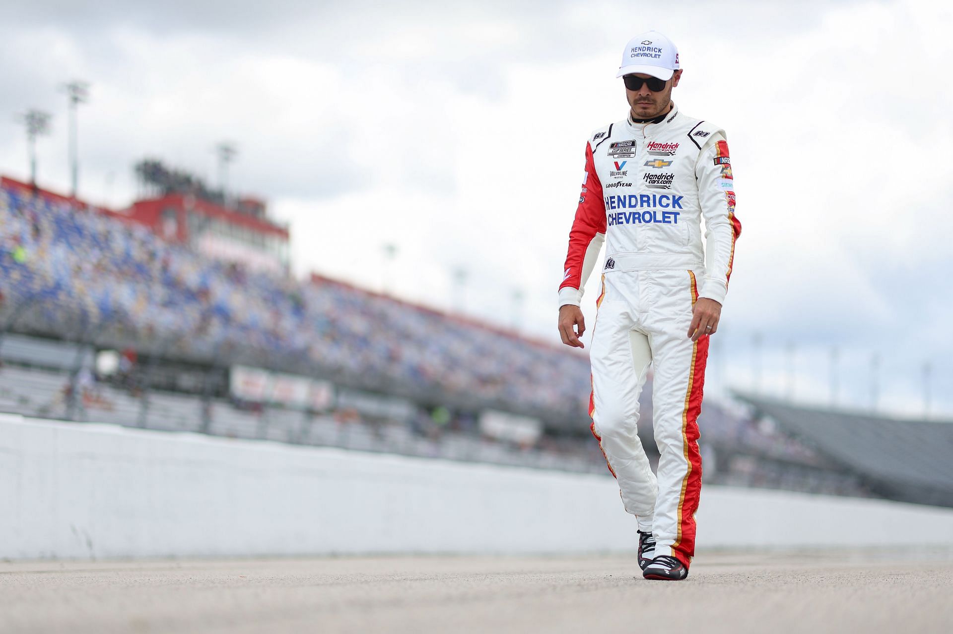 Kyle Larson walks the grid during qualifying for the NASCAR Cup Series Goodyear 400 at Darlington Raceway.
