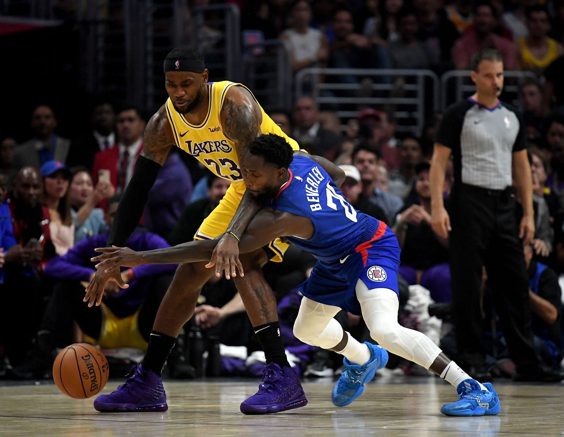 Patrick Beverley and LeBron James in action during LA Lakers versus Los Angeles Clippers.