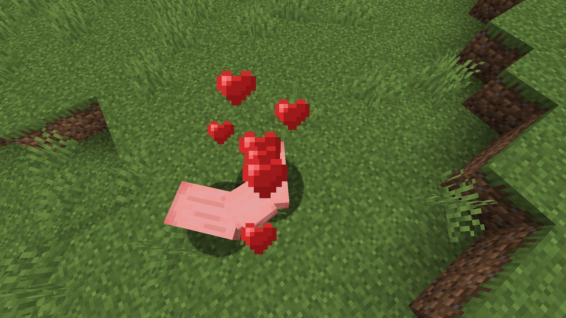 Two willing pigs breeding (Image via Minecraft)