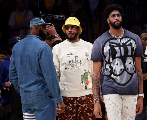 LeBron, Melo and AD - courtside during the Lakers' final regular season game