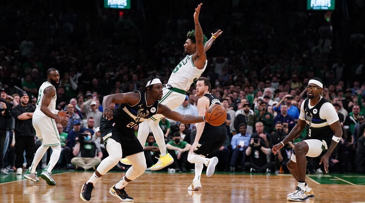 Three seconds after blocking Marcus Smart&#039;s shot, Jrue Holiday stripped the ball from Boston&#039;s point guard to seal the Bucks&#039; win. [Photo: Sports Illustrated]