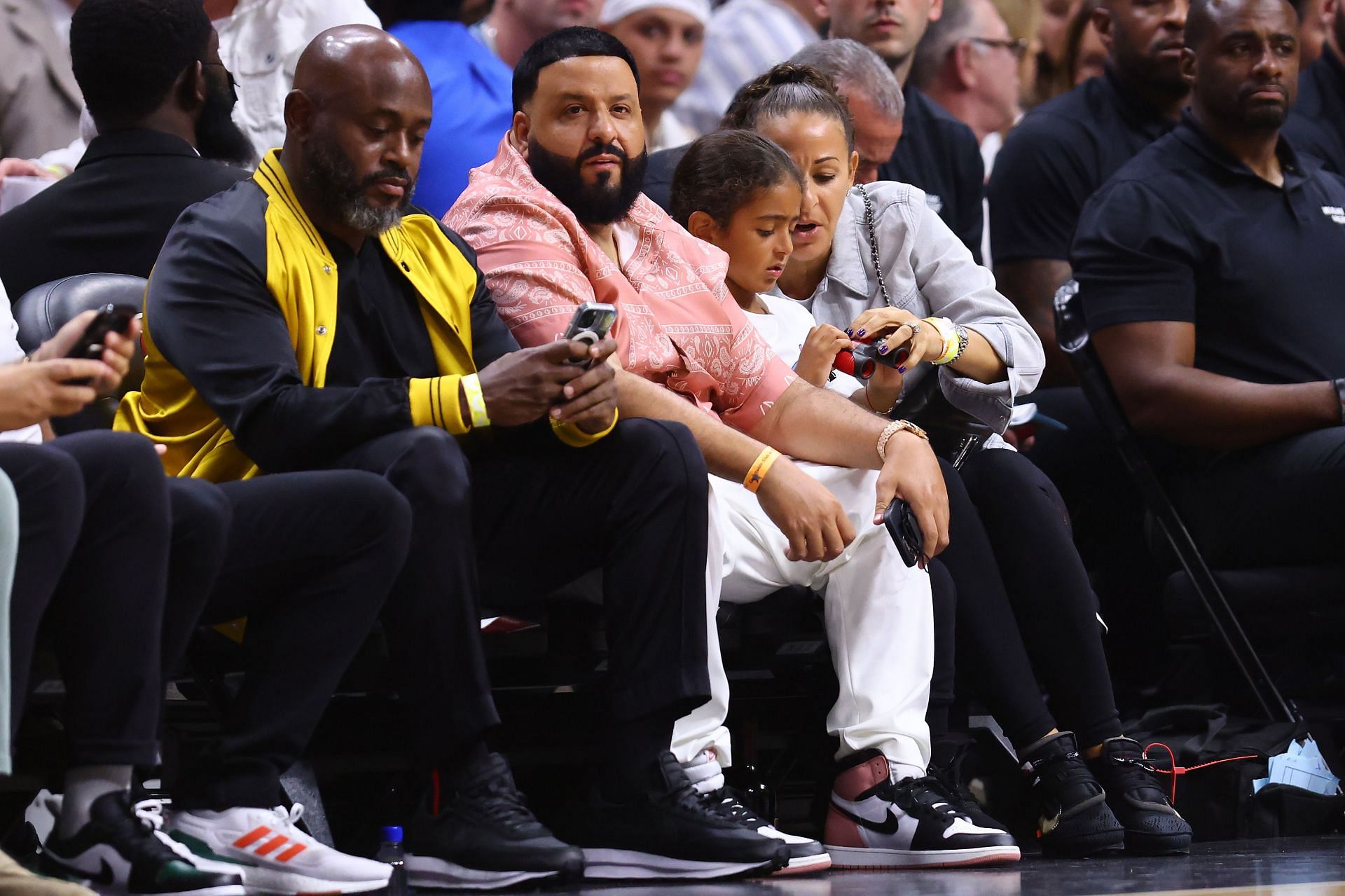 DJ Khaled with his wife and child at the FTX Arena in Miami on Tuesday for Game 5 of the Eastern Conference semifinals.