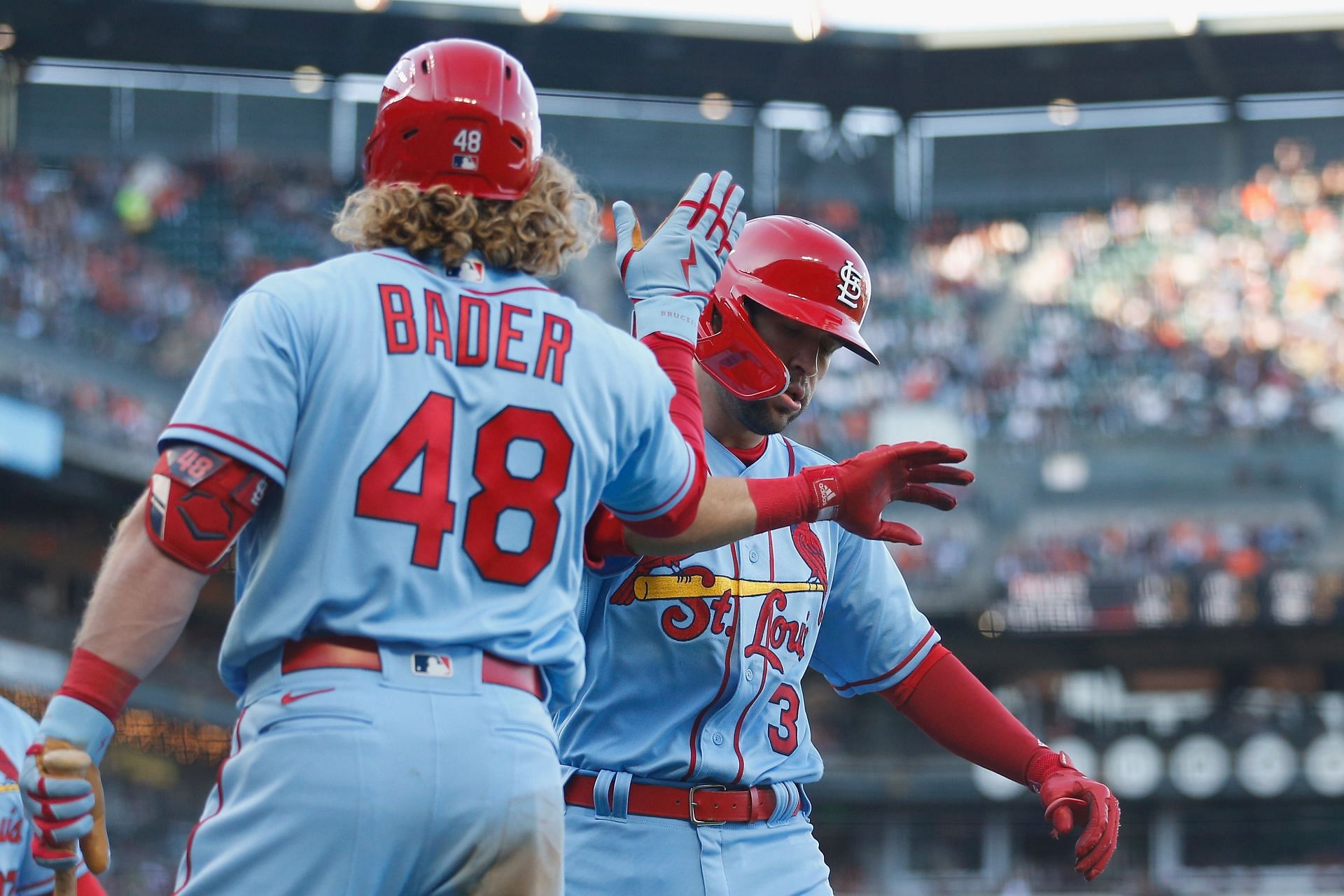 Dylan Carlson of the St. Louis Cardinals celebrates with Harrison Bader after hitting a three-run home run.