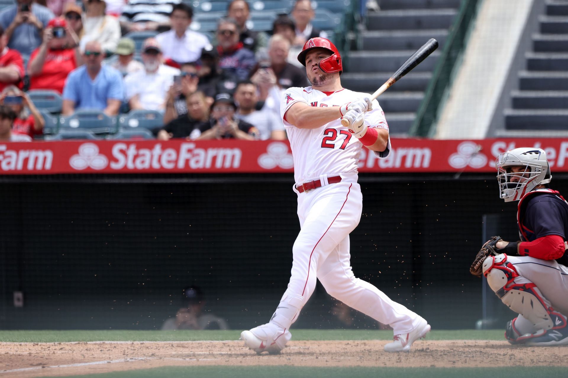 Mike Trout rips a ball down the left field line during a Cleveland Guardians v Los Angeles Angels game.