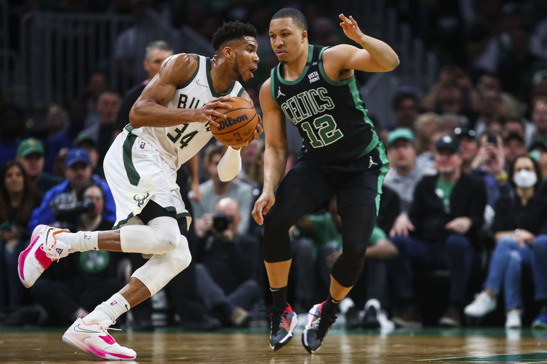 Giannis Antetokounmpo of the Milwaukee Bucks drives to the basket past Grant Williams of the Boston Celtics