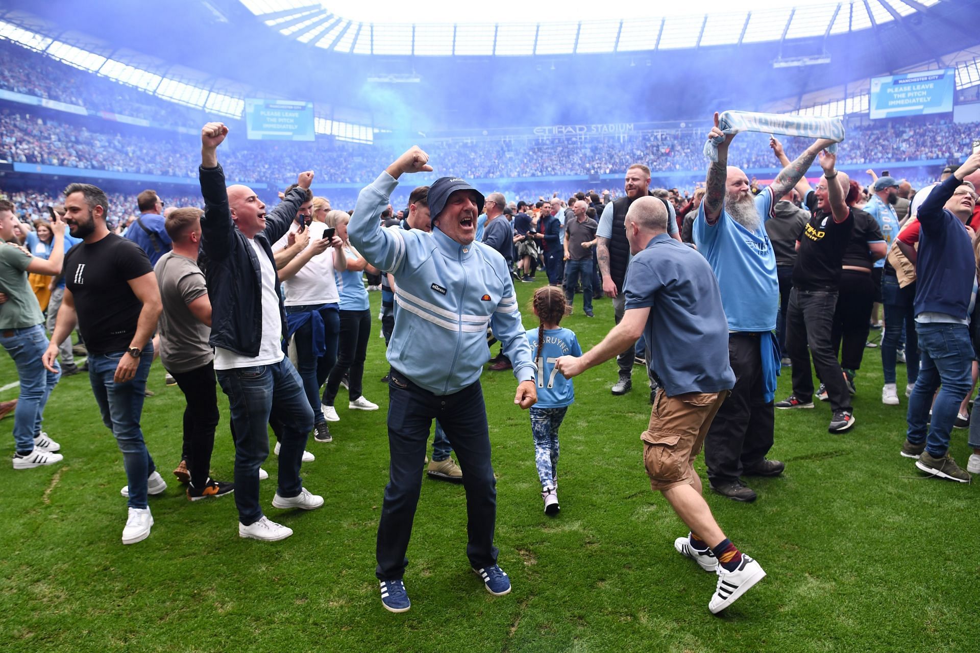 Manchester City fans celebrating after their team&#039;s win