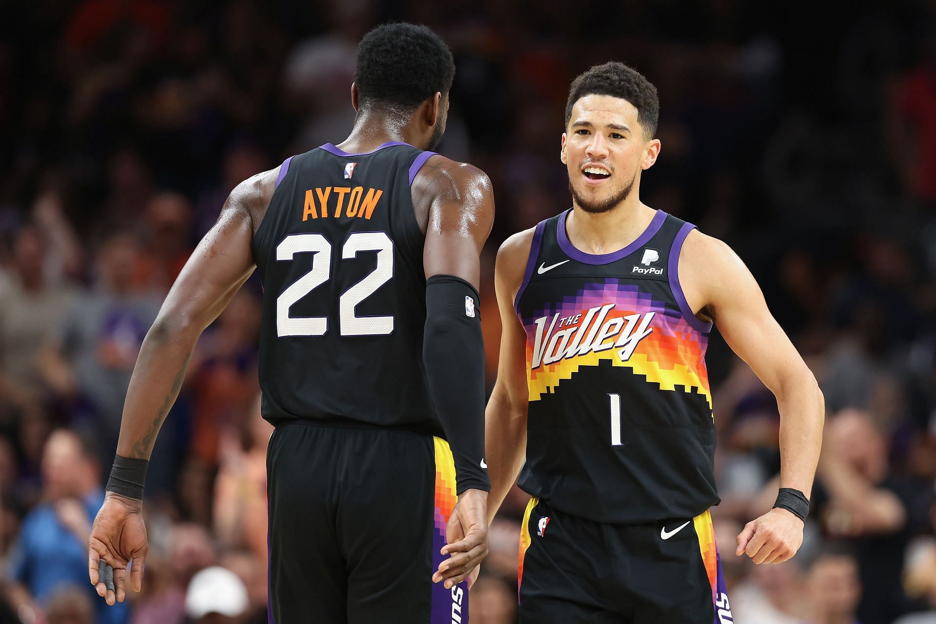 Devin Booker of the Suns celebrates with Deandre Ayton in Game 1.