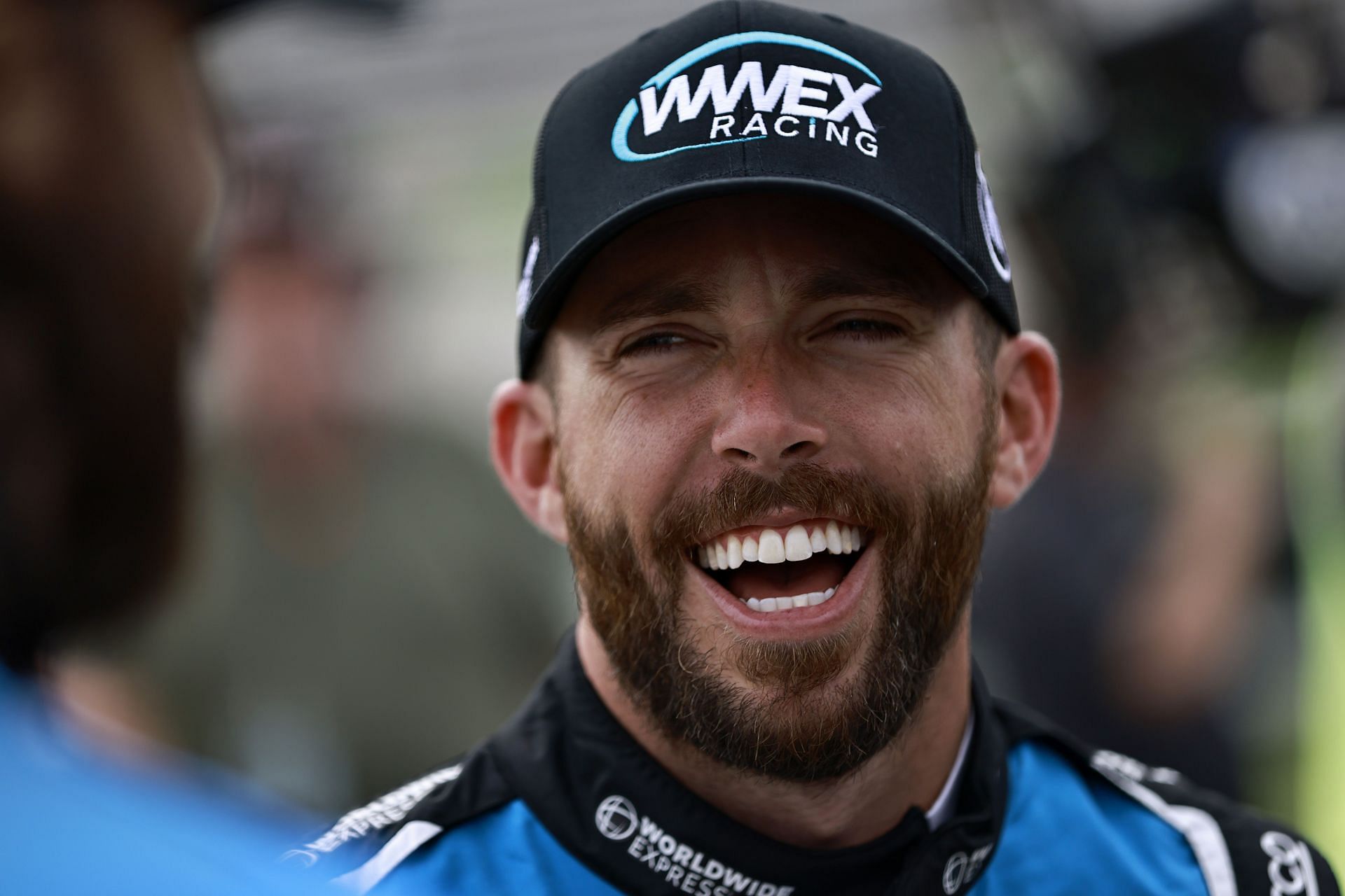 Ross Chastain shares a laugh with crew during qualifying for the NASCAR Cup Series All-Star Race at Texas Motor Speedway