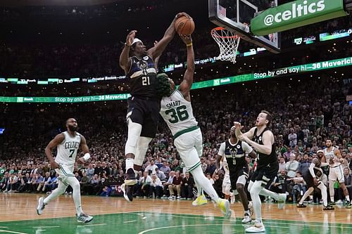 Jrue Holiday's elite defense pushed the Milwaukee Bucks to a stunning come-from-behind win over the Boston Celtics in Game 5. [The Washington Post]