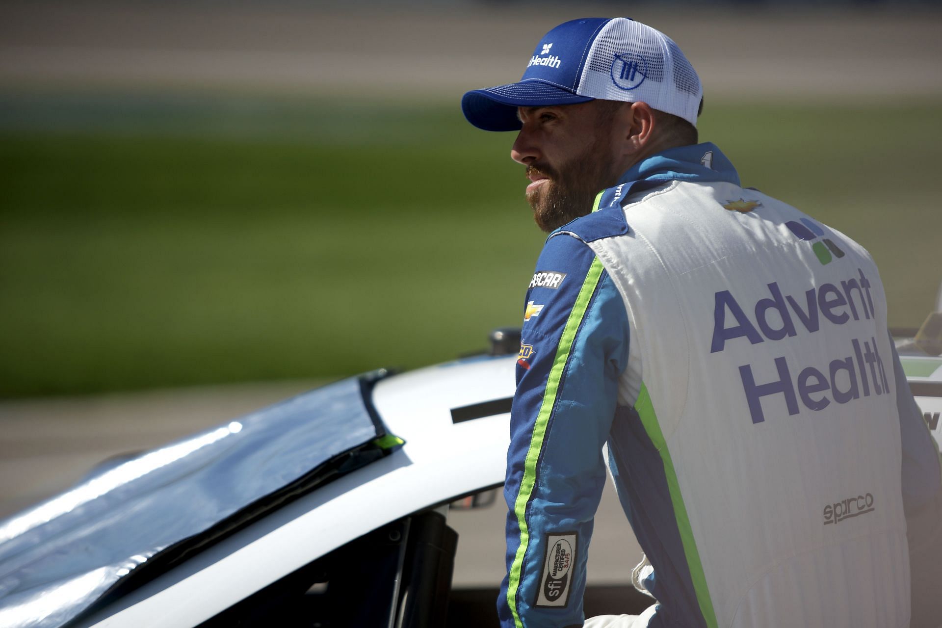 Ross Chastain enters his car during practice for the NAS CAR Cup Series AdventHealth 400 at Kansas Speedway