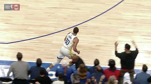 An American Airlines Arena waiter's tray caused Steph Curry to trip in the first half of Game 3 between the Golden State Warriors and Dallas Mavericks. [Photo: SFGate]