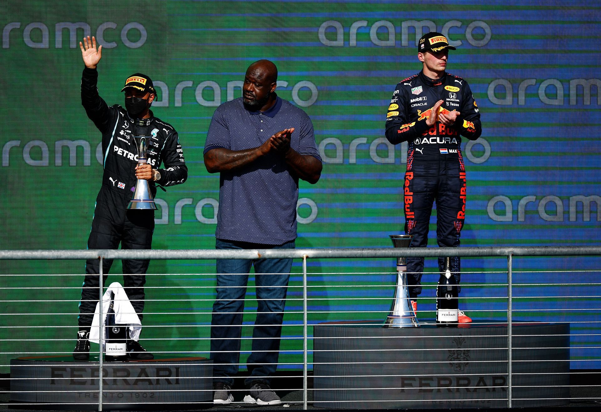 Max Verstappen of Red Bull Racing and Lewis Hamilton of Mercedes with Shaquille O&#039;Neal on the podium during the F1 Grand Prix of USA