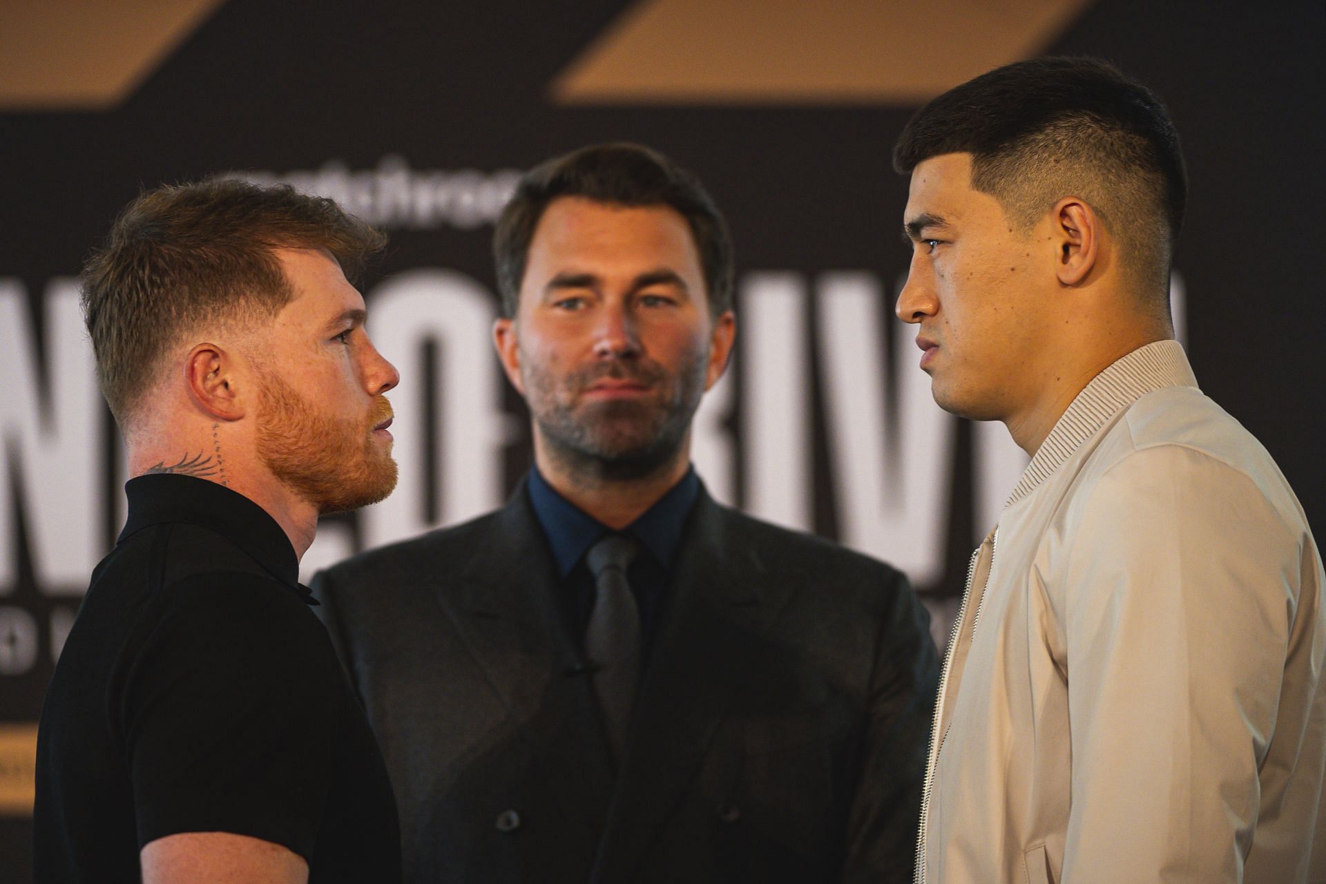 Canelo Alvarez (left), Eddie Hearn (center) and Dmitry Bivol (right) at a press conference before the big fight.