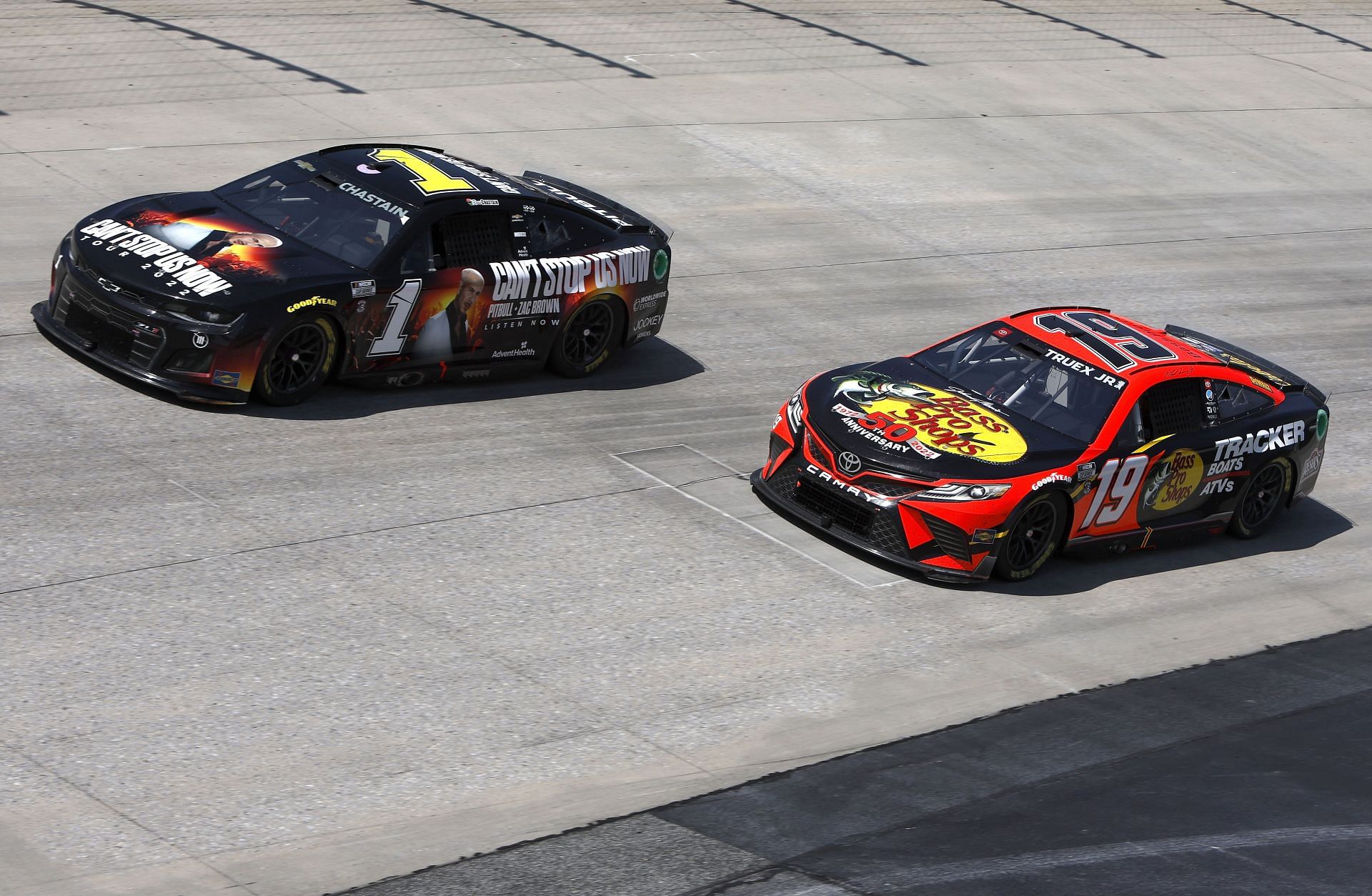 Ross Chastain and Martin Truex Jr. race during the NASCAR Cup Series DuraMAX Drydene 400 presented by RelaDyne at Dover Motor Speedway.